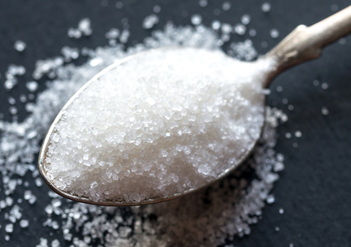 Spoon with white sugar.